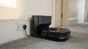 Inspecting the dock water heating station featured in a comprehensive hot water mop robot vacuum review.