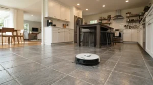 A robot vacuum mop for large homes mopping splash marks on a large kitchen tile floor